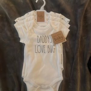 Three Rae Dunn. Onesies